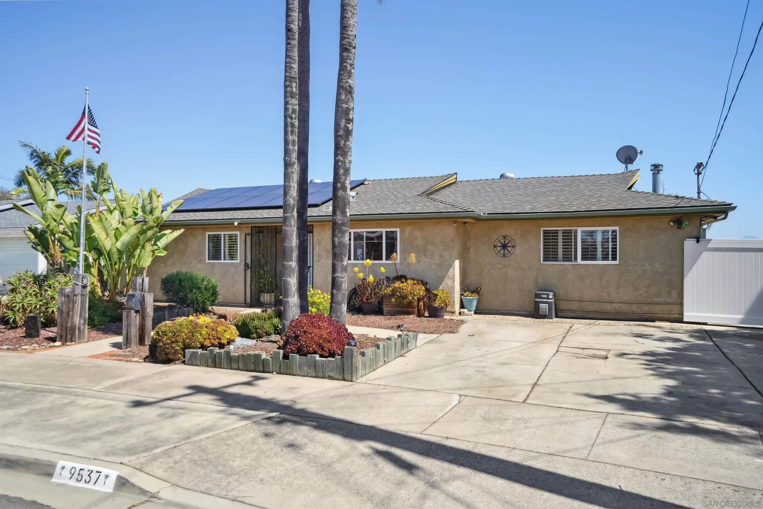9537 East Hartland Circle Santee, CA 92071 - Photo 23 of 42 a front view of a house with garden