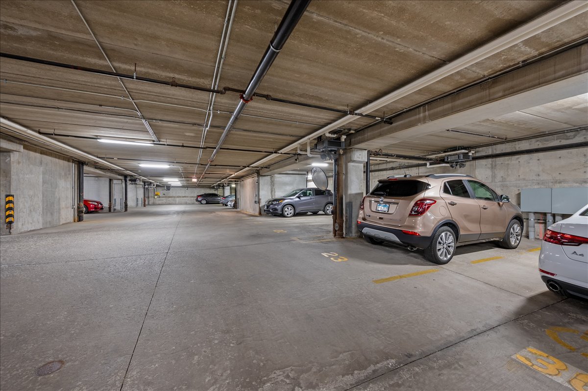 811 West 15th Place, Unit 708 Chicago, IL 60608 - Photo 26 of 28 a view of parking garage with cars parked