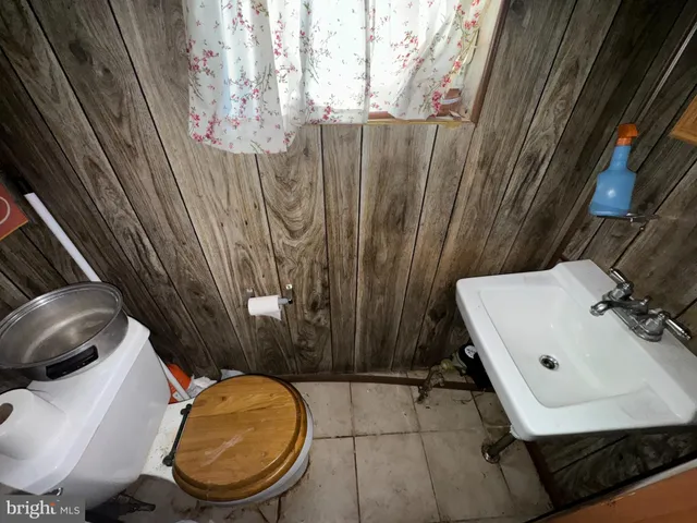 a bathroom with a toilet and a sink