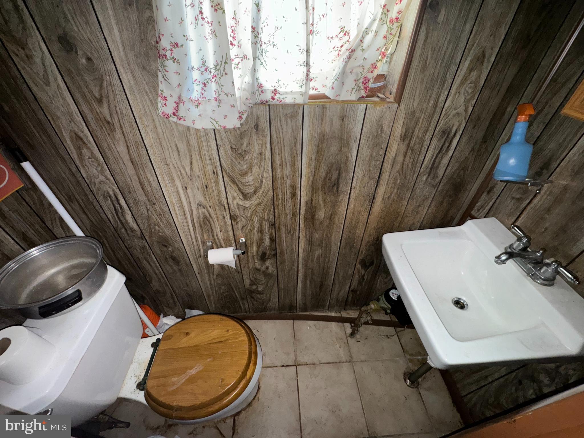 9955 Bridle Road Philadelphia, PA 19115 - Photo 11 of 14 a bathroom with a toilet and a sink