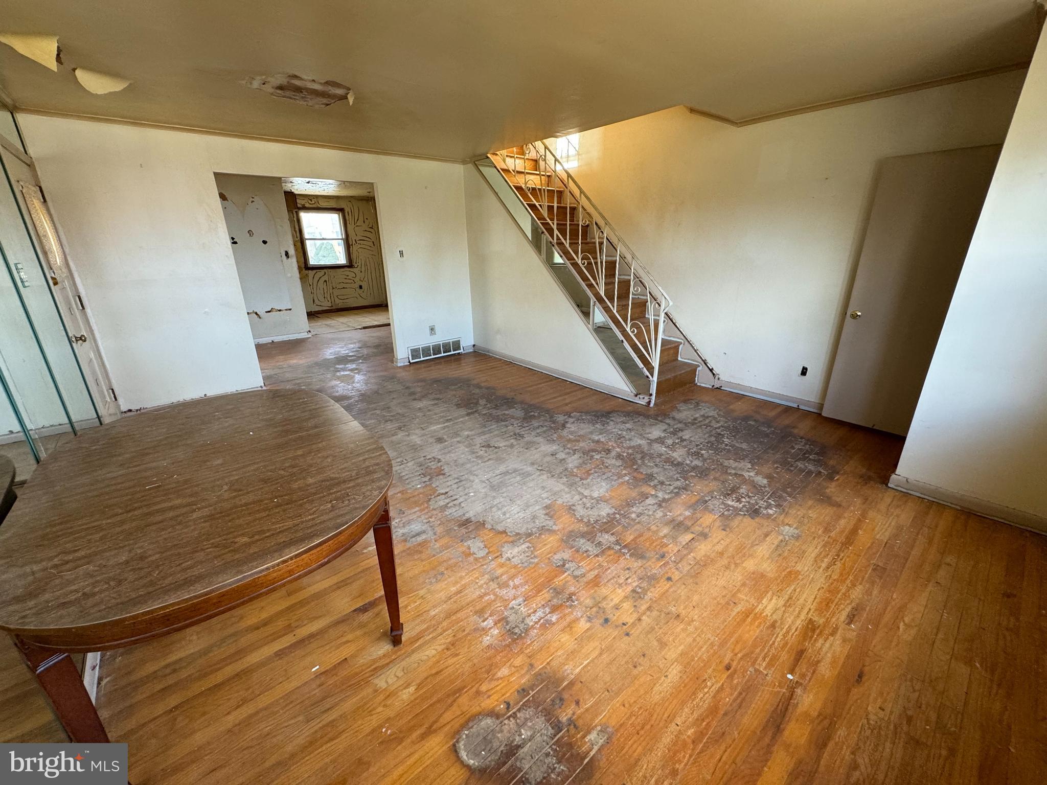 9955 Bridle Road Philadelphia, PA 19115 - Photo 4 of 14 a view of a livingroom with wooden floor and stairs
