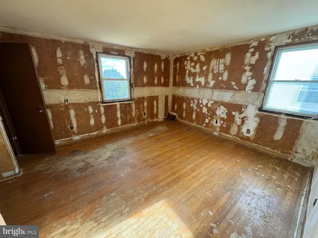 a view of an entryway with wooden floor