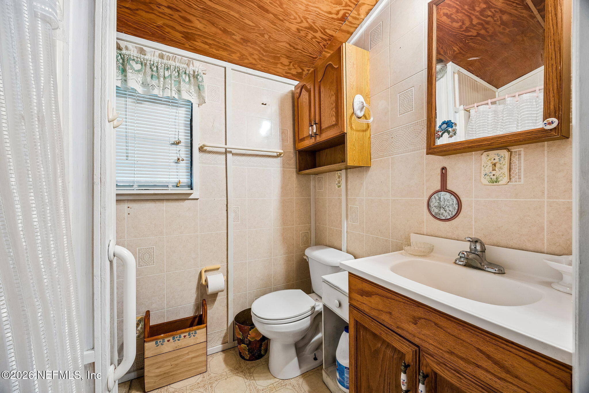 15690 Sears Road Jacksonville, FL 32218 - Photo 17 of 27 a bathroom with a sink toilet and shower