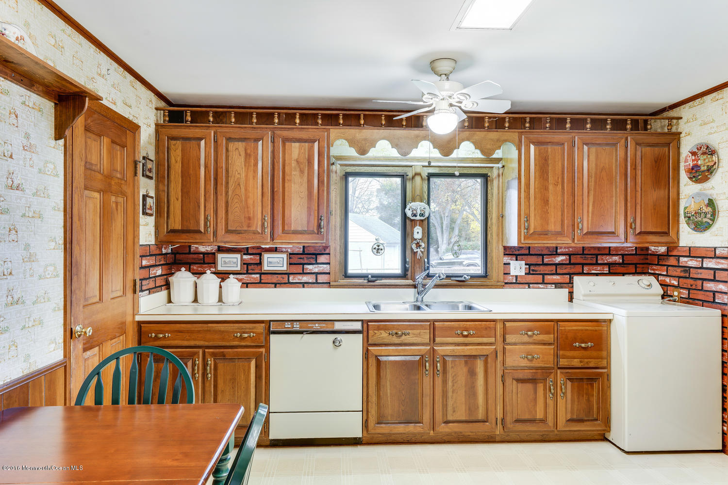 63 Cannon Road Freehold, NJ 07728 - Photo 16 of 34 a kitchen with a sink cabinets and window