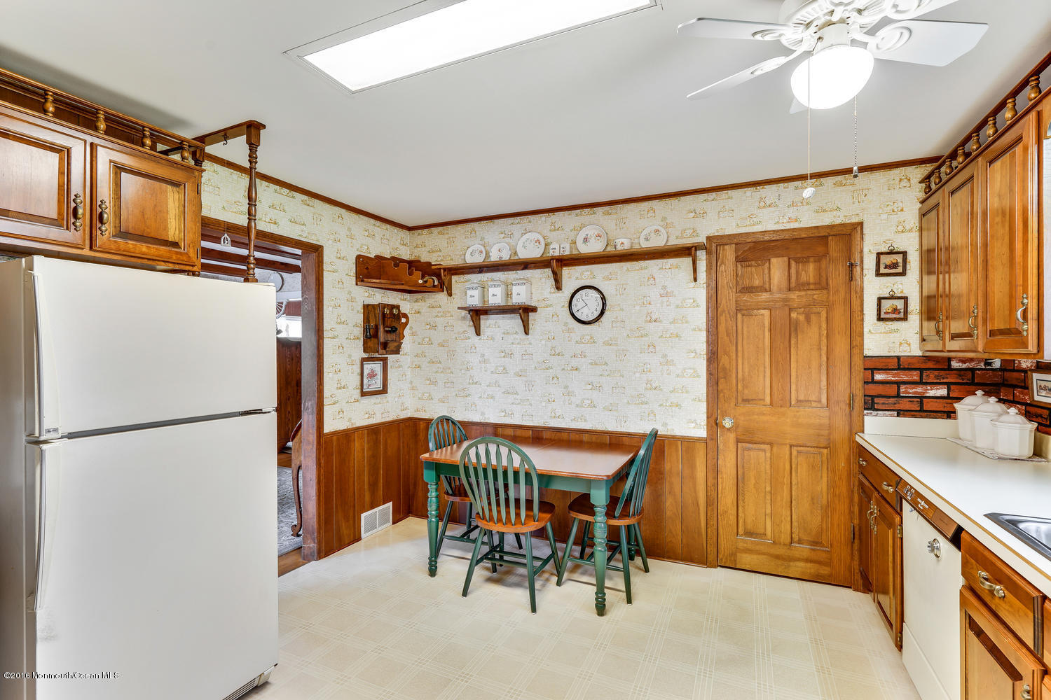63 Cannon Road Freehold, NJ 07728 - Photo 18 of 34 a kitchen with stainless steel appliances granite countertop a stove a refrigerator and a dining table