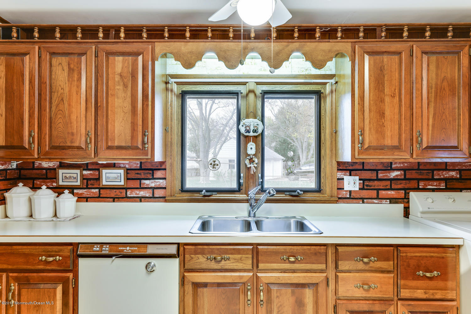 63 Cannon Road Freehold, NJ 07728 - Photo 19 of 34 a view of a kitchen with a sink and cabinets