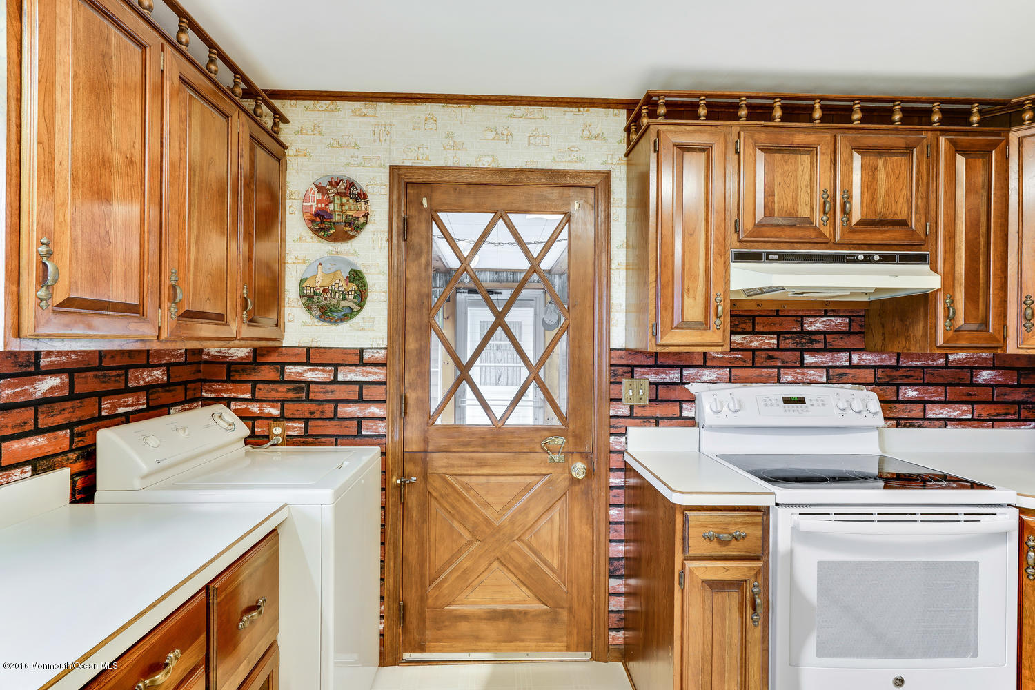 63 Cannon Road Freehold, NJ 07728 - Photo 21 of 34 a kitchen with a sink a stove and a refrigerator