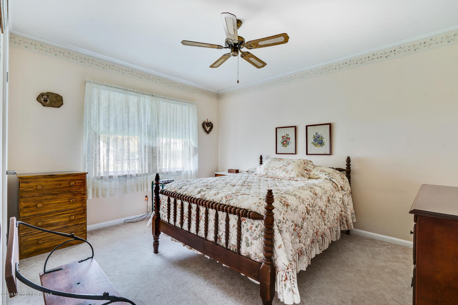 63 Cannon Road Freehold, NJ 07728 - Photo 24 of 34 a bed room with a bed and a chandelier