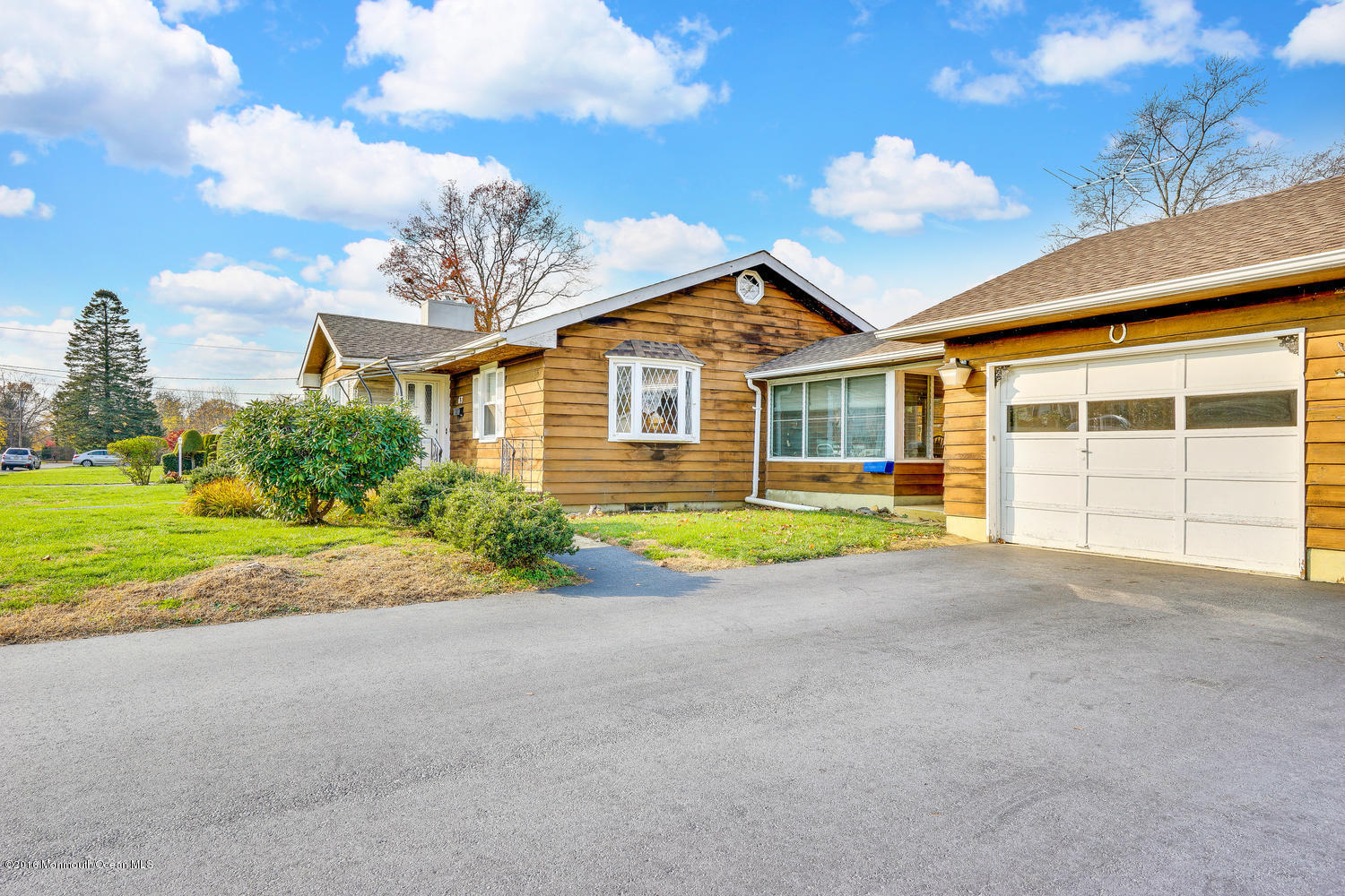 63 Cannon Road Freehold, NJ 07728 - Photo 6 of 34 a view of a house with a backyard and a tree