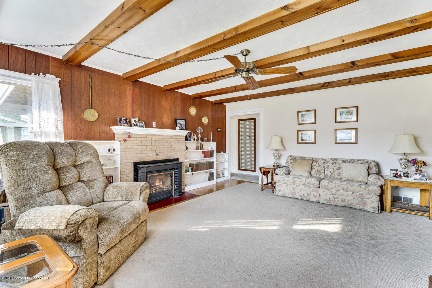 63 Cannon Road Freehold, NJ 07728 - Photo 9 of 34 a living room with furniture and a fireplace