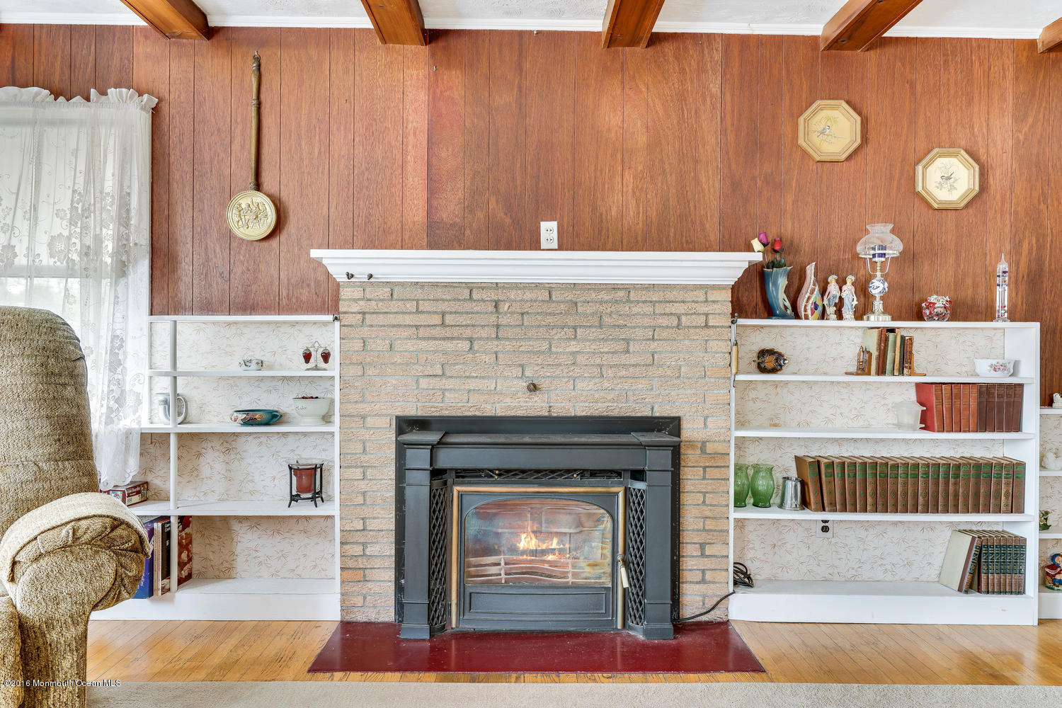 63 Cannon Road Freehold, NJ 07728 - Photo 10 of 34 a living room with furniture and a fireplace