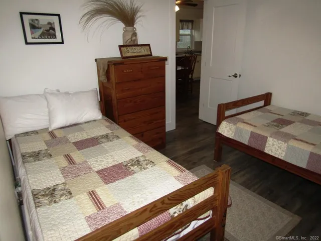 a bedroom with a bed and a dresser