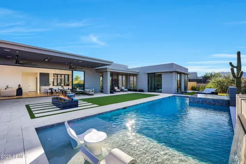 a lobby with furniture and a projector screen