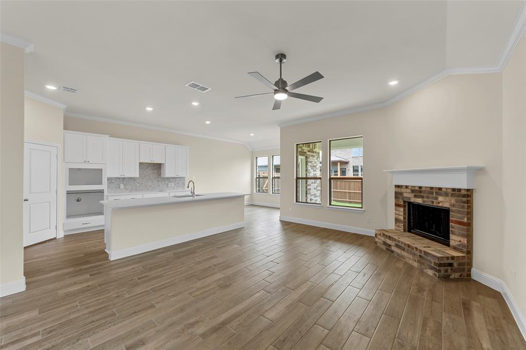 1508 Addison Lane Lancaster, TX 75134 - Photo 6 of 20 Open-concept living space featuring wood-finish flooring, a contemporary ceiling fan, and recessed lighting