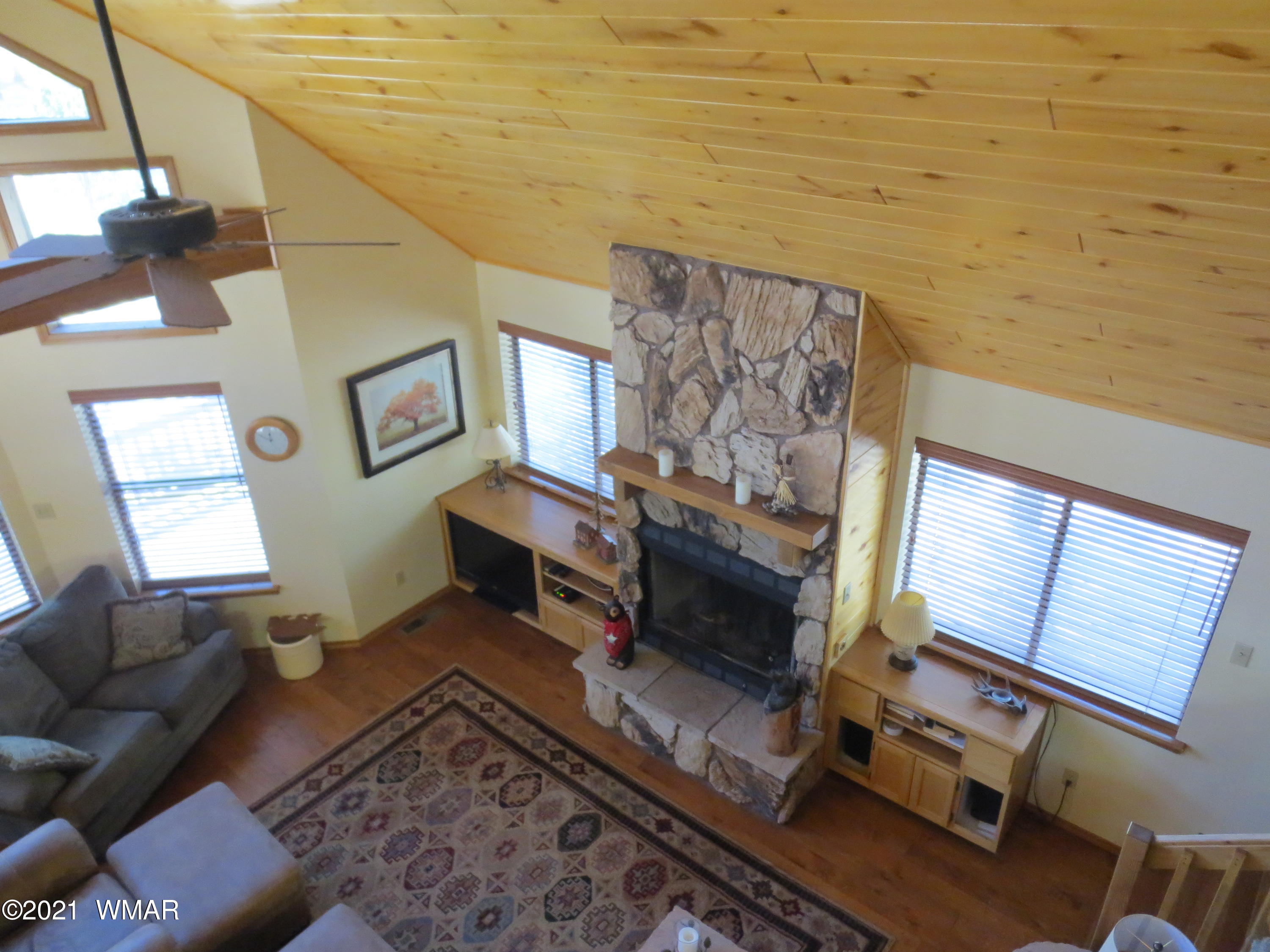 2970 Monica Road Overgaard, AZ 85933 - Photo 18 of 37 a living room with furniture and a fireplace