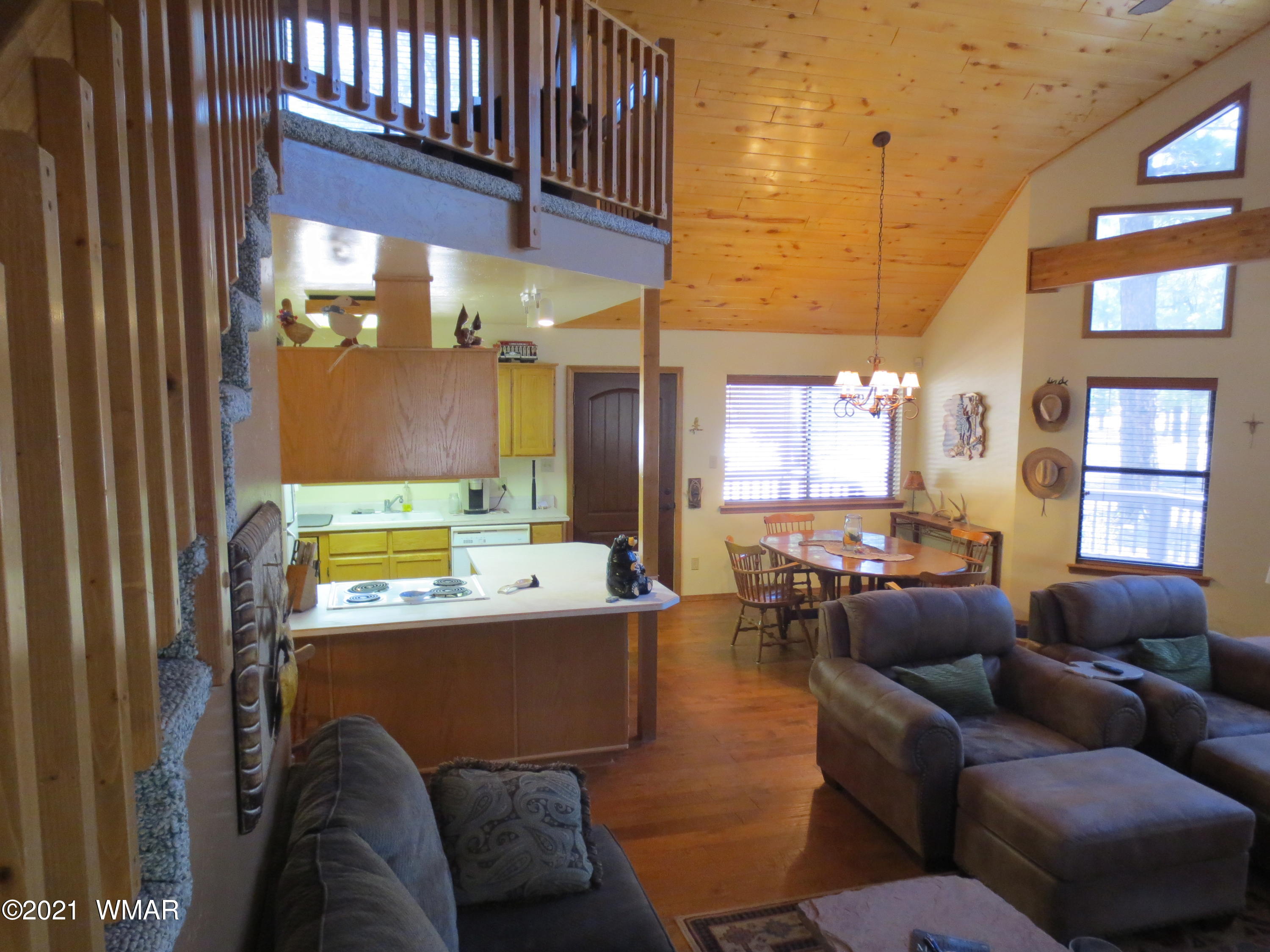 2970 Monica Road Overgaard, AZ 85933 - Photo 19 of 37 a living room with furniture and a large window