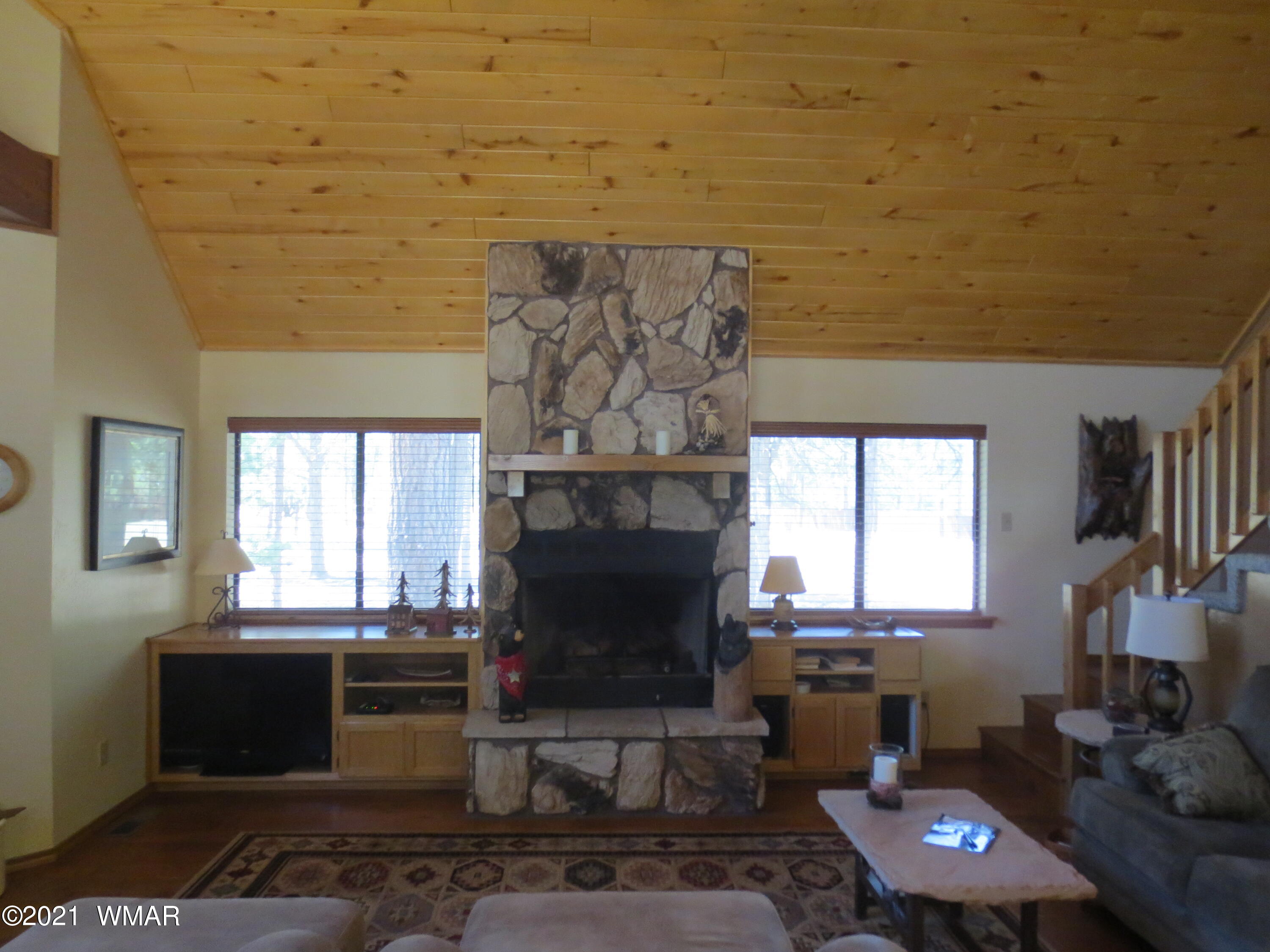 2970 Monica Road Overgaard, AZ 85933 - Photo 22 of 37 a living room with furniture and a fireplace