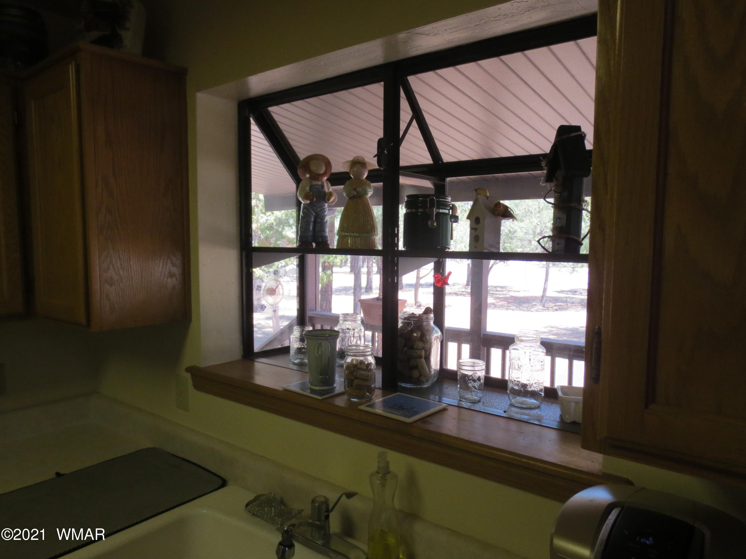 2970 Monica Road Overgaard, AZ 85933 - Photo 24 of 37 a view of a living room with a large window and wooden floor