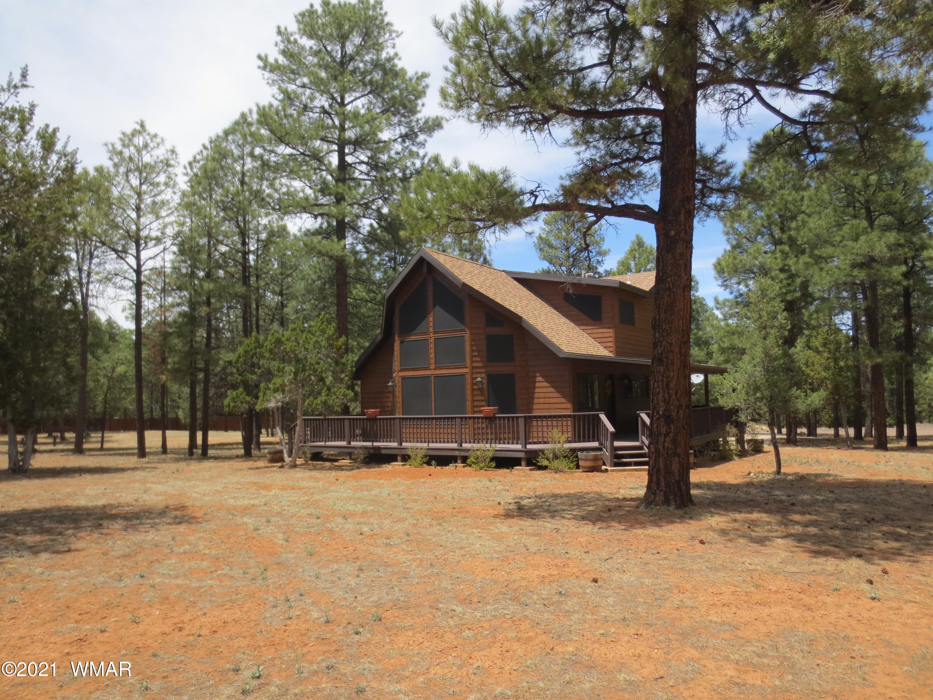 2970 Monica Road Overgaard, AZ 85933 - Photo 3 of 37 a view of a house with a yard