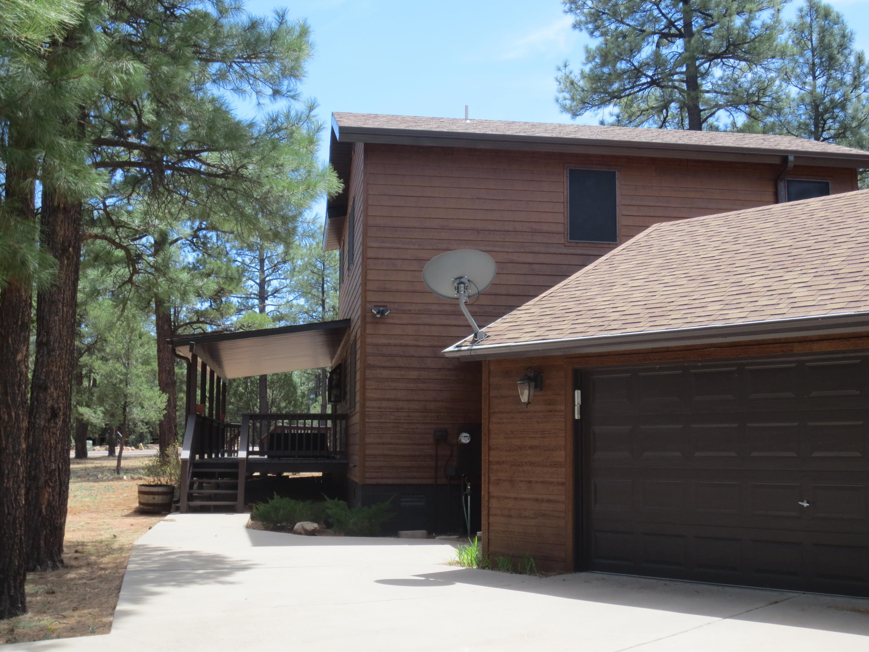 2970 Monica Road Overgaard, AZ 85933 - Photo 5 of 37 a front view of a house with a yard