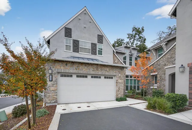 a front view of a house with a garage
