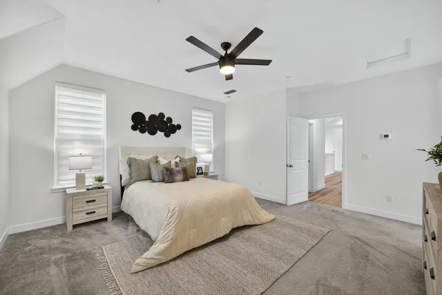 a bedroom with a bed and window