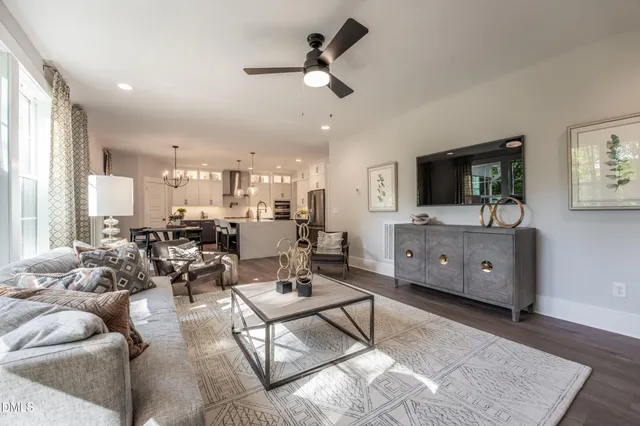 a view of hallway with living room and furniture