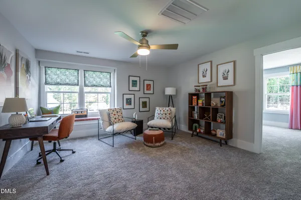 a bathroom with a double vanity sink a toilet a mirror and shower