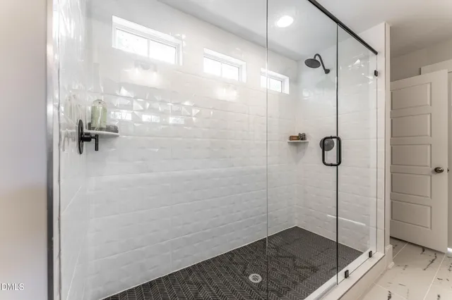 a bed room with a bed and a chair