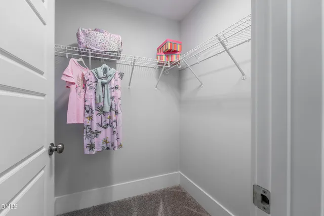 a view of a hallway with washer and dryer