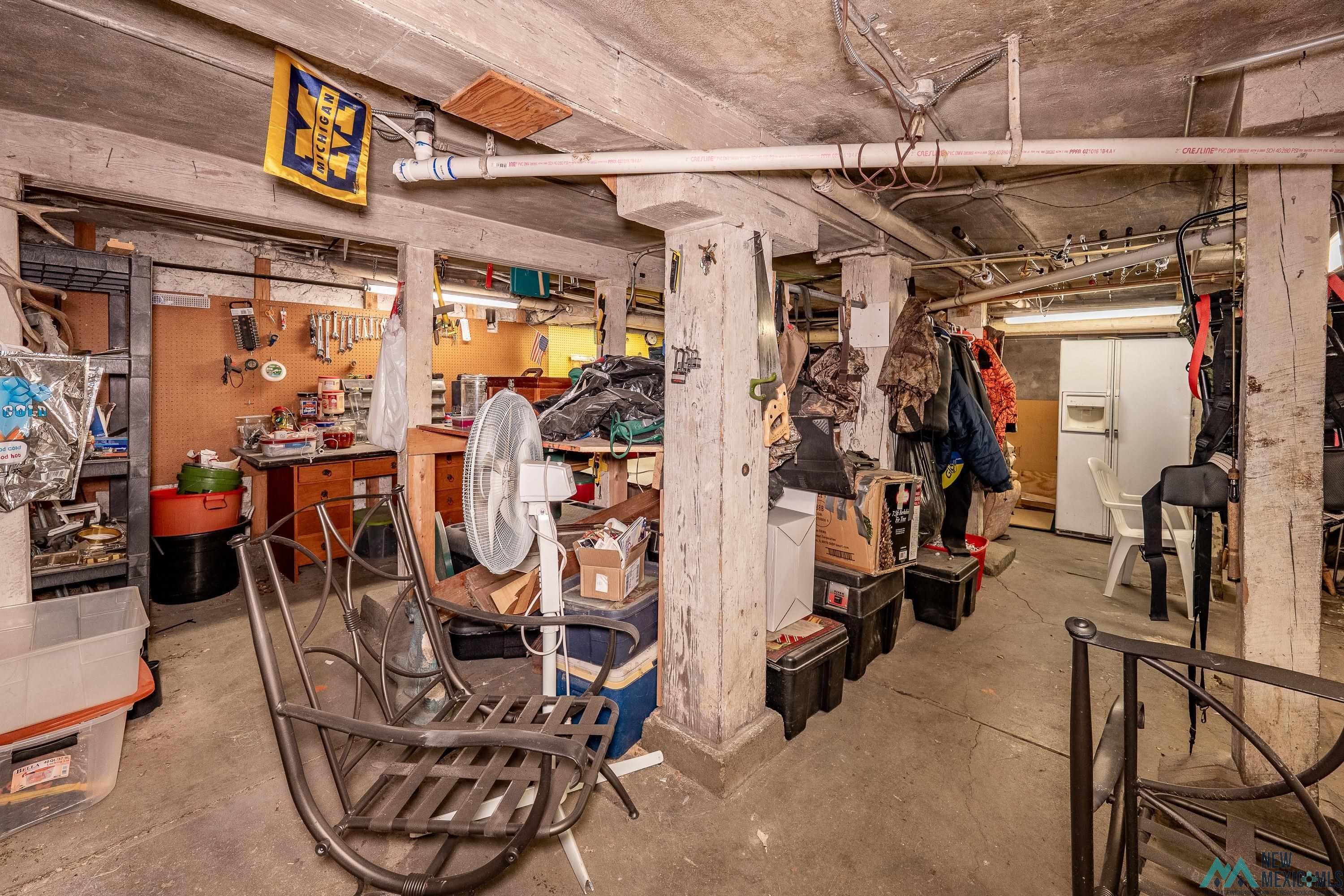 301 South 4th Street Raton, NM 87740 - Photo 40 of 78 Below grade area featuring white refrigerator with ice dispenser