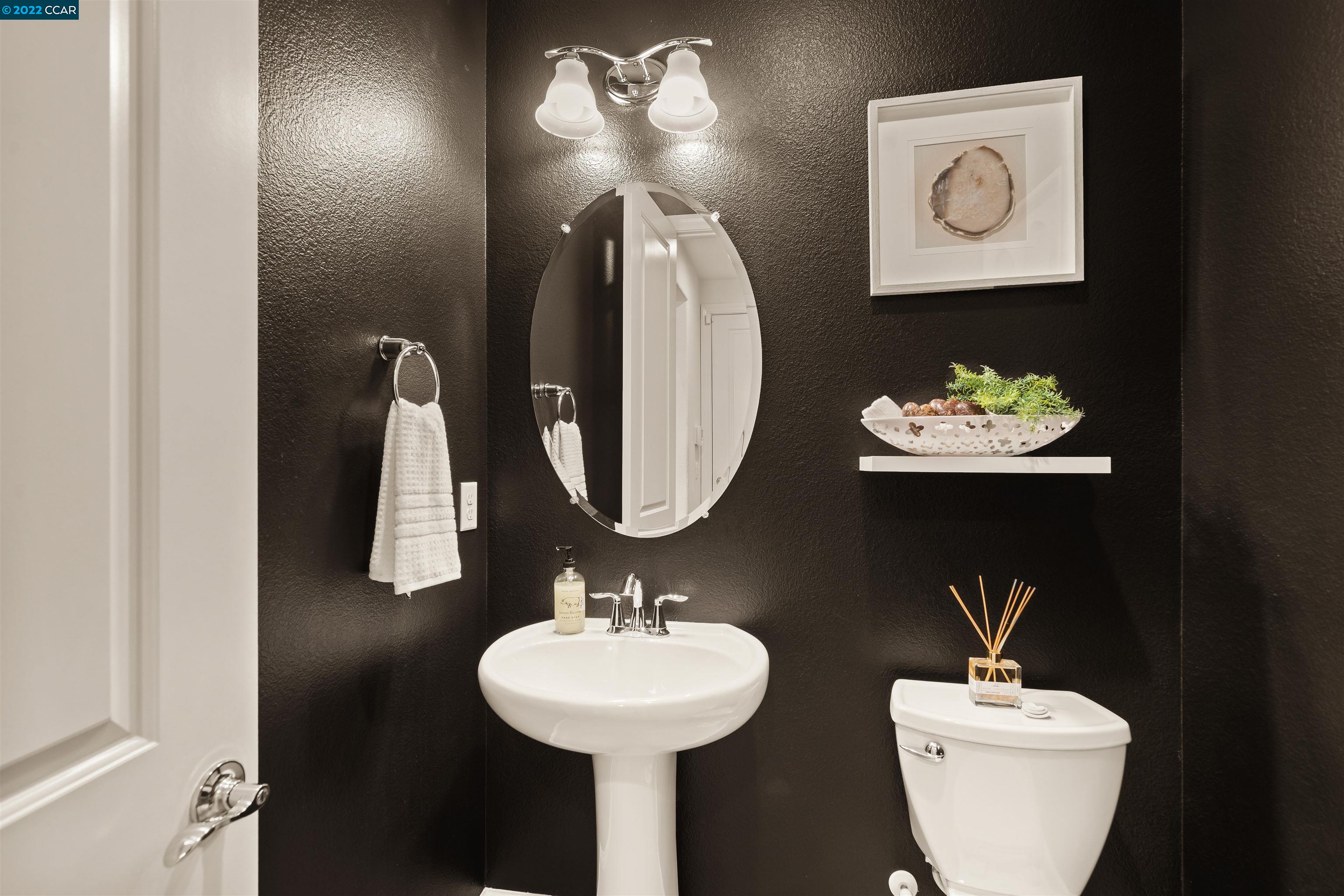 2468 Flag Stop Way Tracy, CA 95377 - Photo 11 of 36 a bathroom with a sink and a mirror