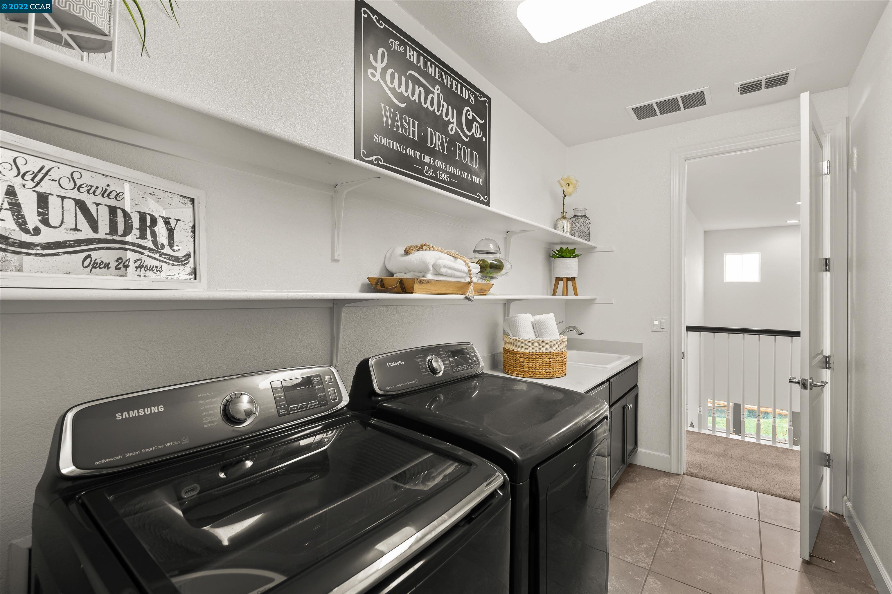 2468 Flag Stop Way Tracy, CA 95377 - Photo 24 of 36 a room with a stove and a refrigerator