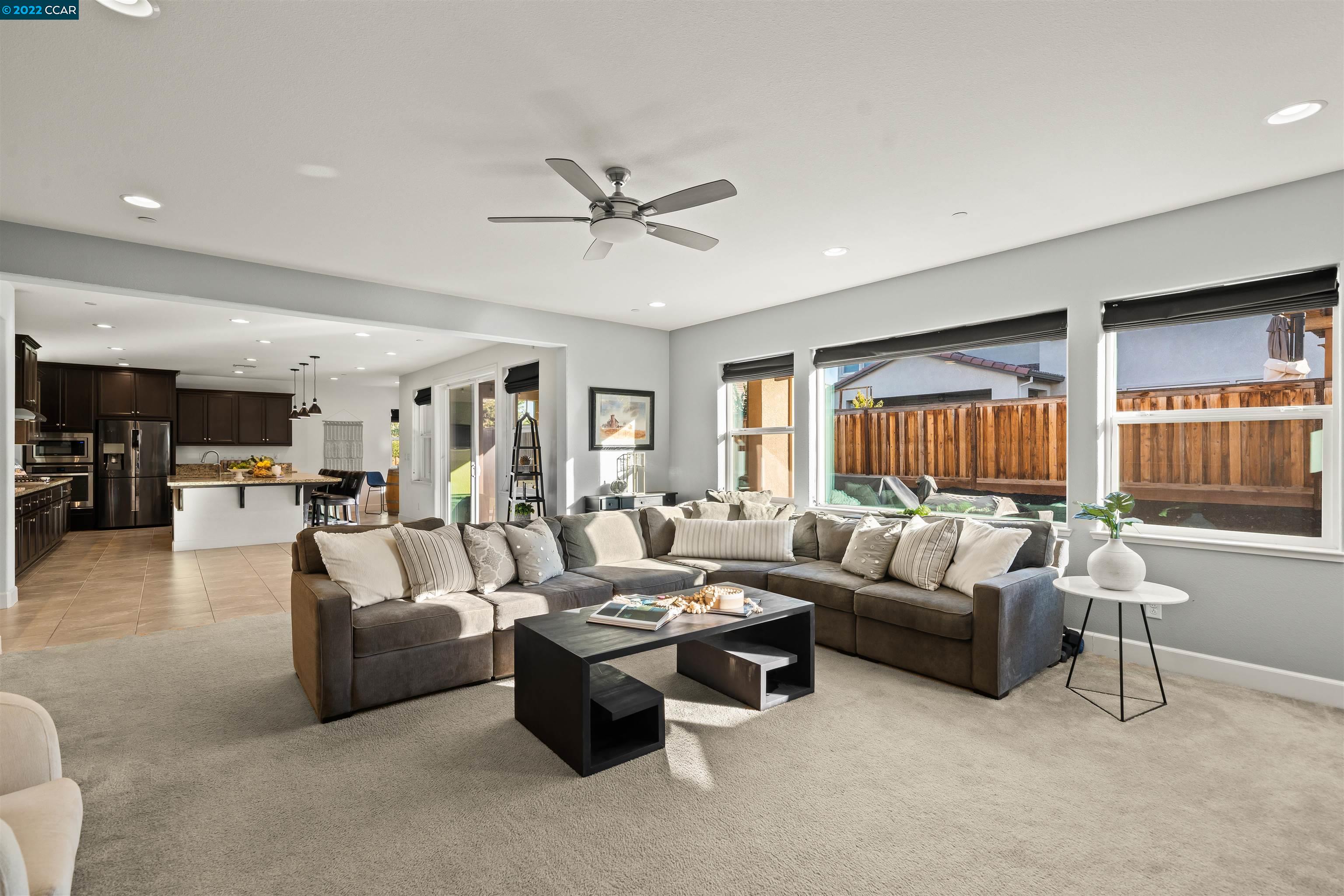 2468 Flag Stop Way Tracy, CA 95377 - Photo 8 of 36 a living room with furniture and a large window