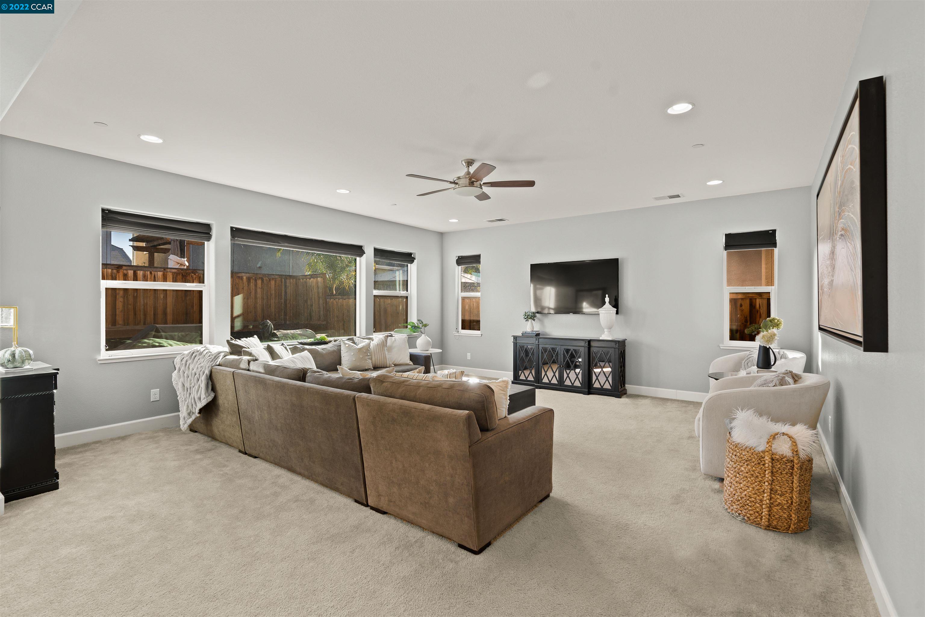 2468 Flag Stop Way Tracy, CA 95377 - Photo 9 of 36 a living room with furniture and a flat screen tv