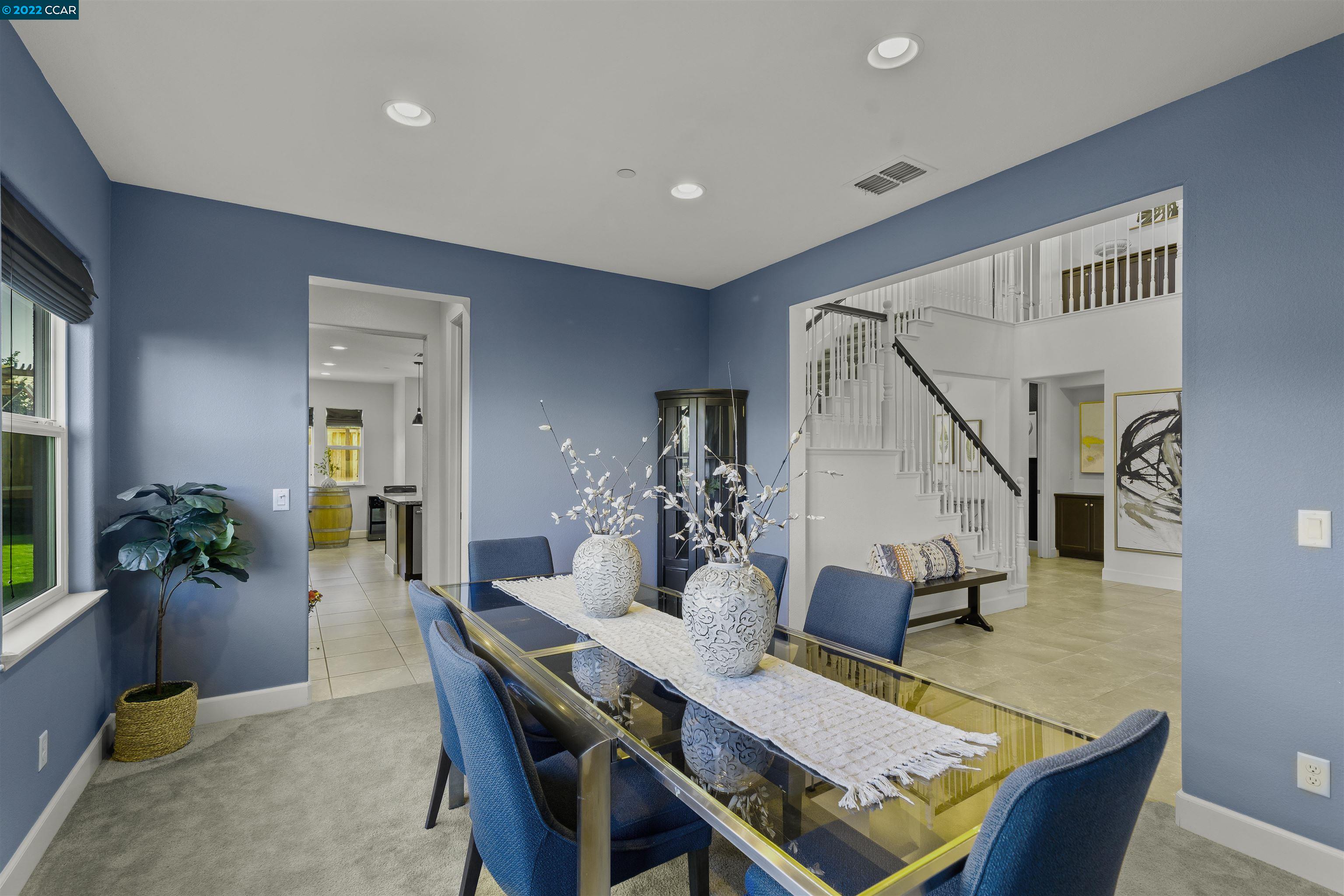 2468 Flag Stop Way Tracy, CA 95377 - Photo 10 of 36 a view of a dining room with furniture and wooden floor