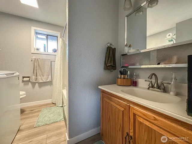 a kitchen with a sink a stove and cabinets