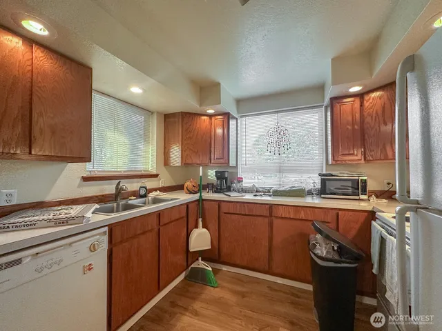 a kitchen with a sink stove and cabinets