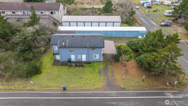 an aerial view of a house with a garden and sitting area