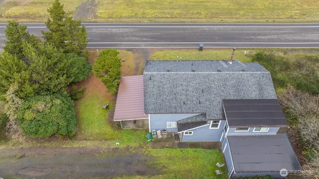 an aerial view of a house with a swimming pool