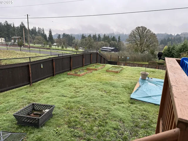 a view of a backyard with sitting area