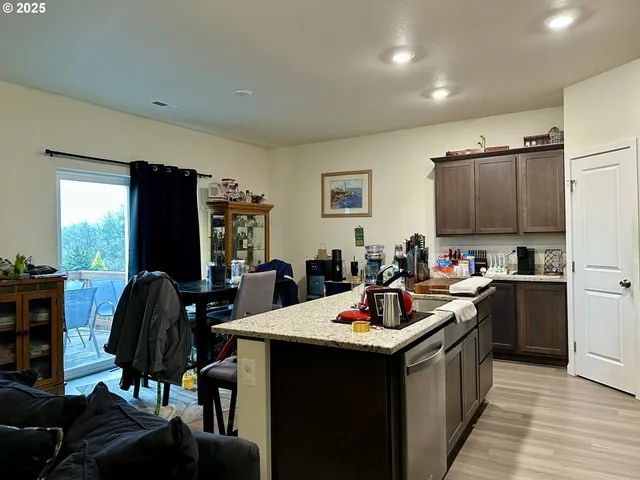 a kitchen with a sink cabinets and appliances