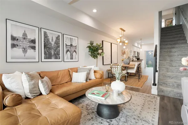 a living room with furniture and a painting