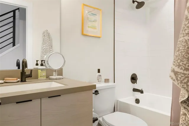 a large bed sitting in a bedroom next to a window