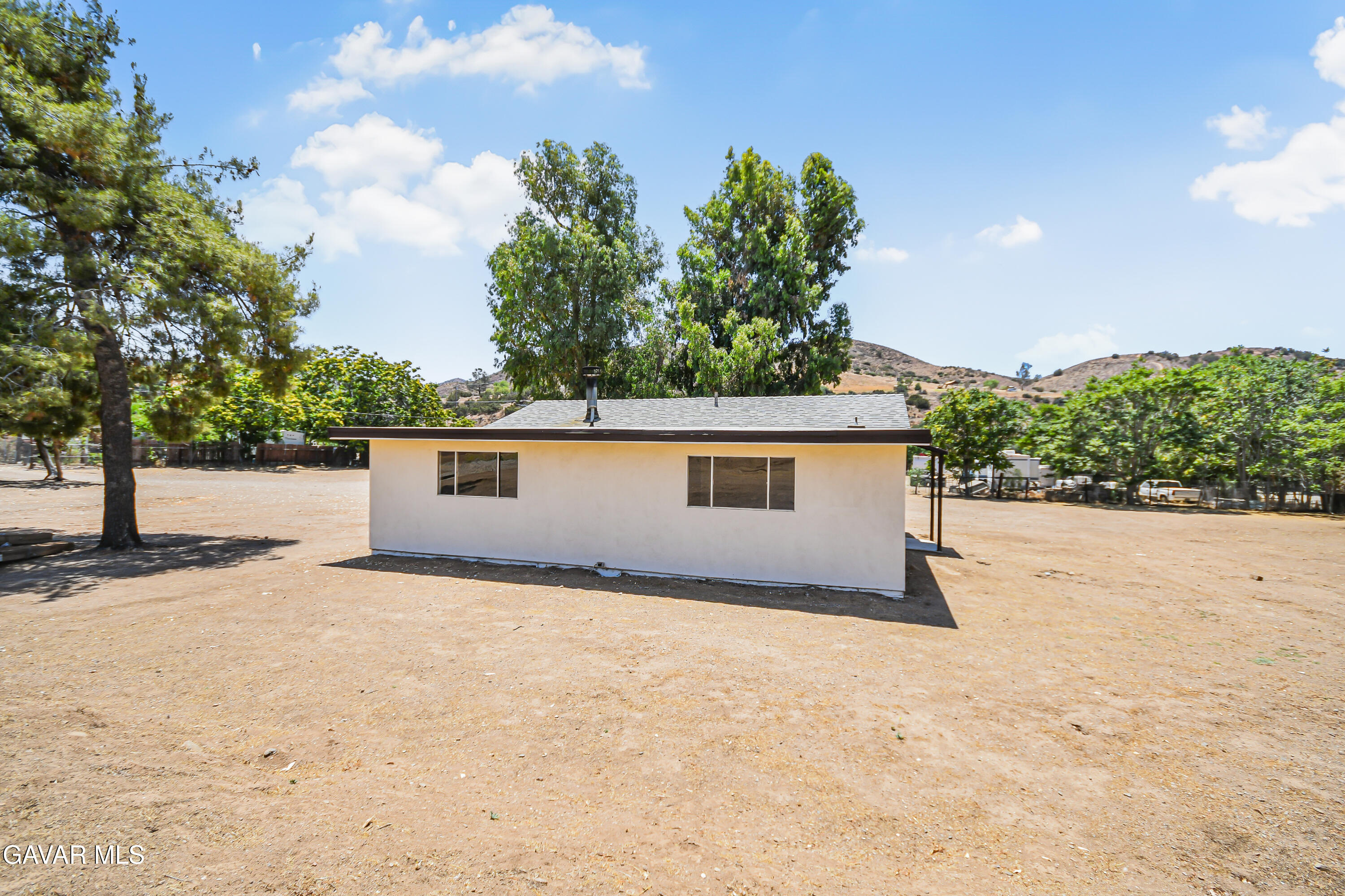 35339 Anthony Road Agua Dulce, CA 91390 - Photo 14 of 20 a house with trees in front of it