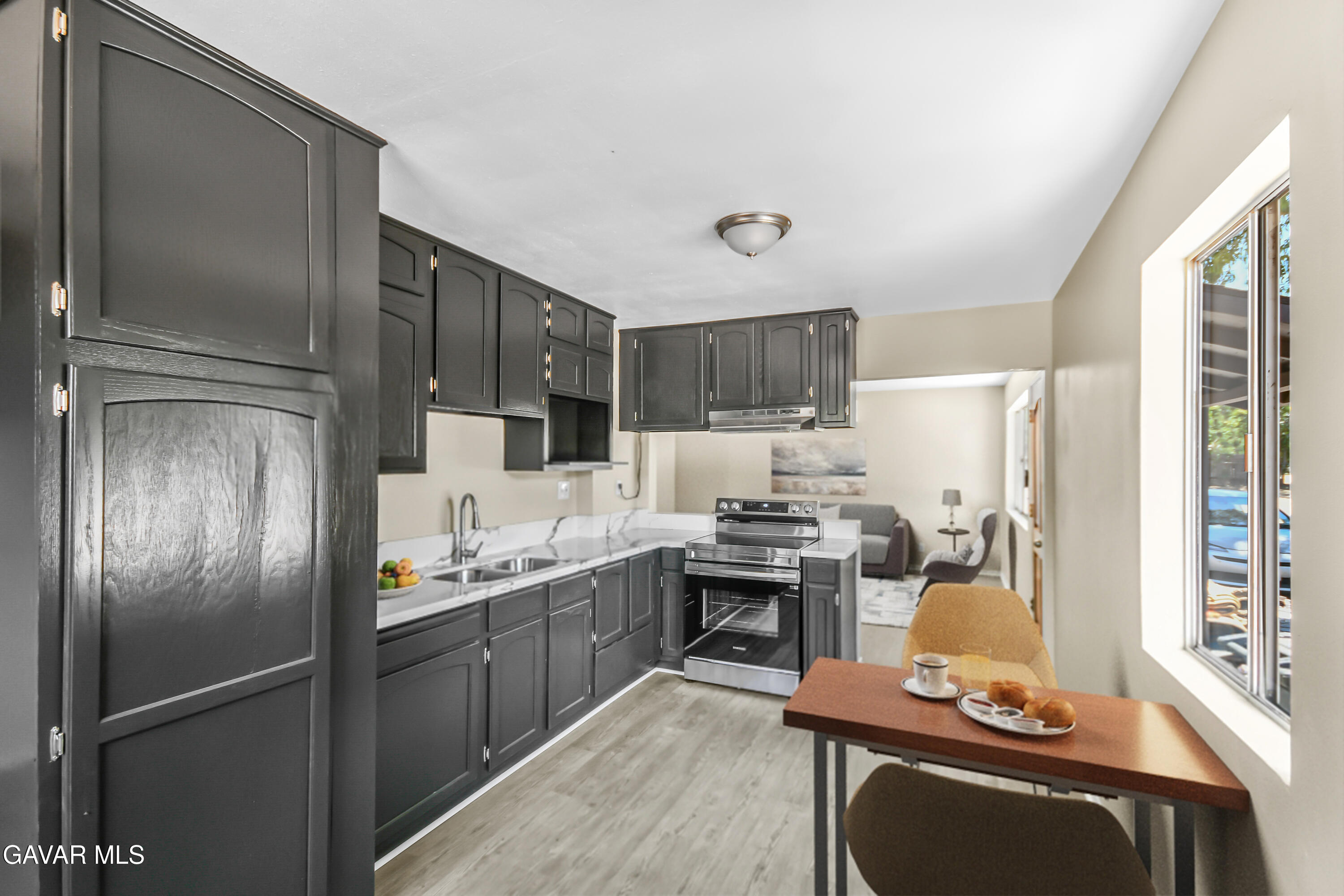 35339 Anthony Road Agua Dulce, CA 91390 - Photo 6 of 20 a kitchen with stainless steel appliances granite countertop a refrigerator stove and sink