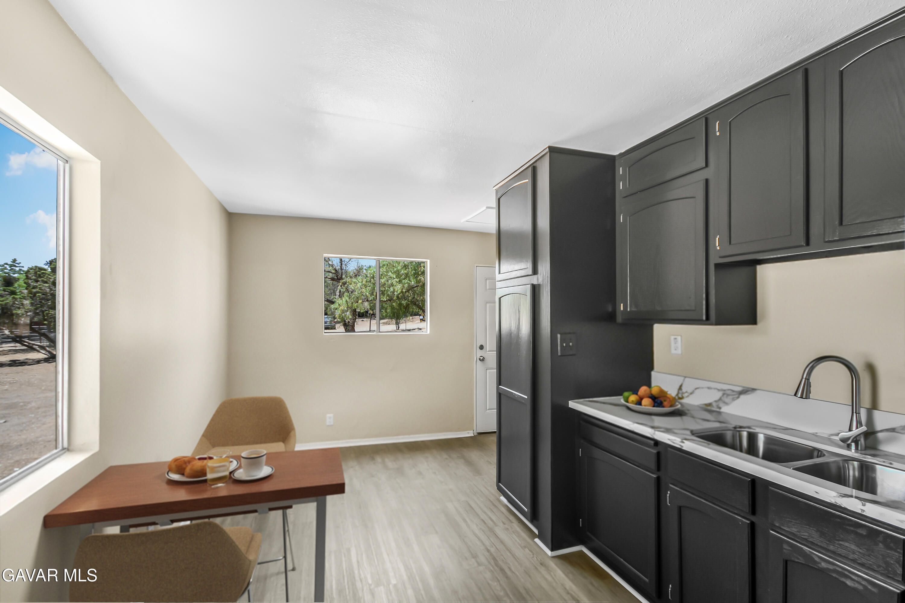 35339 Anthony Road Agua Dulce, CA 91390 - Photo 7 of 20 a kitchen with stainless steel appliances a sink cabinets and wooden floor