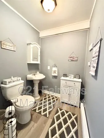 a bathroom with a toilet and a sink