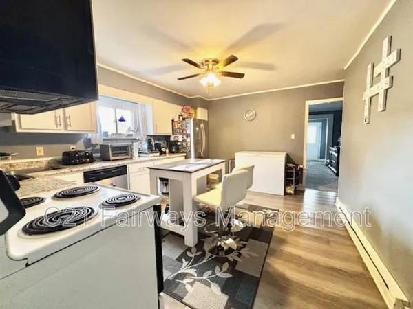 a living room with furniture and white walls