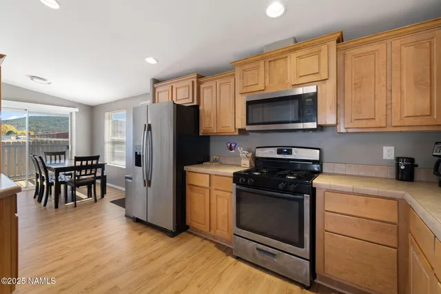 a kitchen with a stove a sink and a microwave